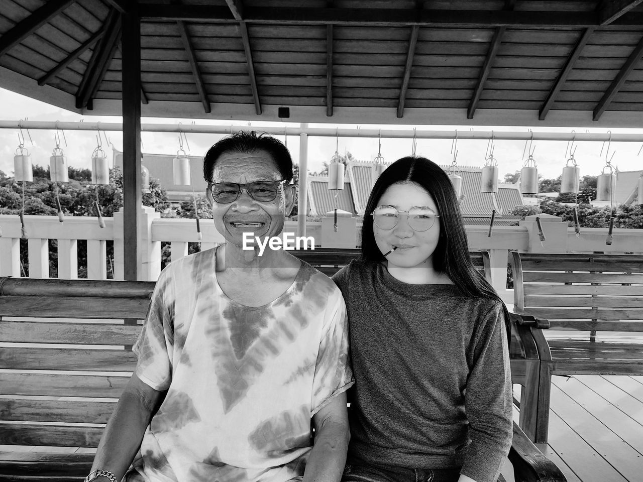 Portrait of smiling young couple standing outdoors