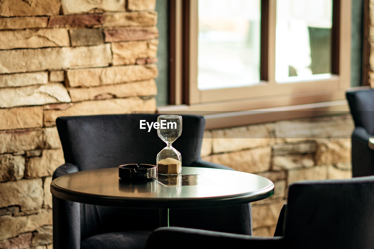 Hourglass on table at restaurant