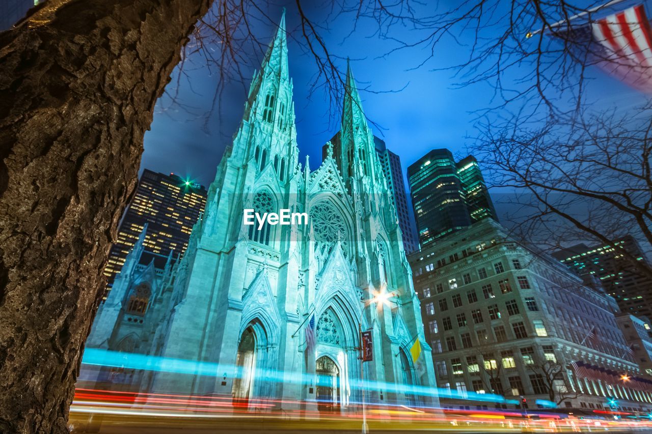 Low angle view of light trail by st patrick cathedral