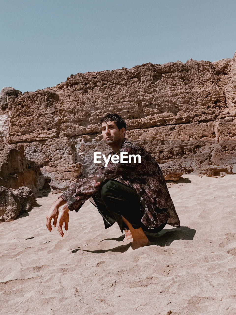 YOUNG MAN ON ROCK