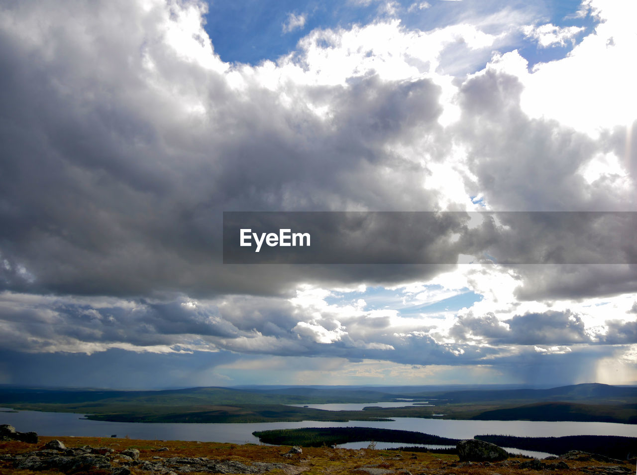 Scenic view of landscape against cloudy sky