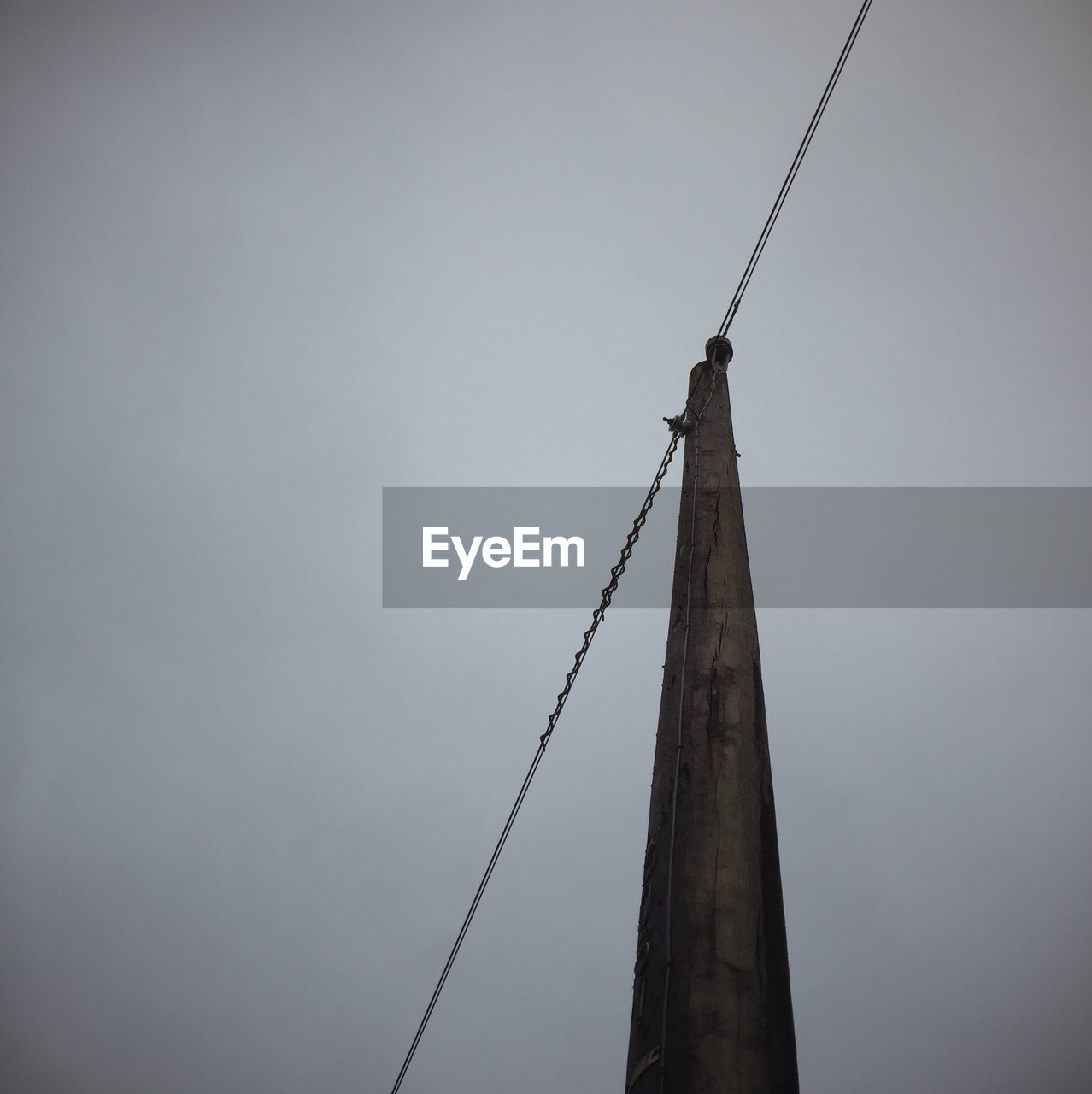 LOW ANGLE VIEW OF POWER LINES AGAINST SKY