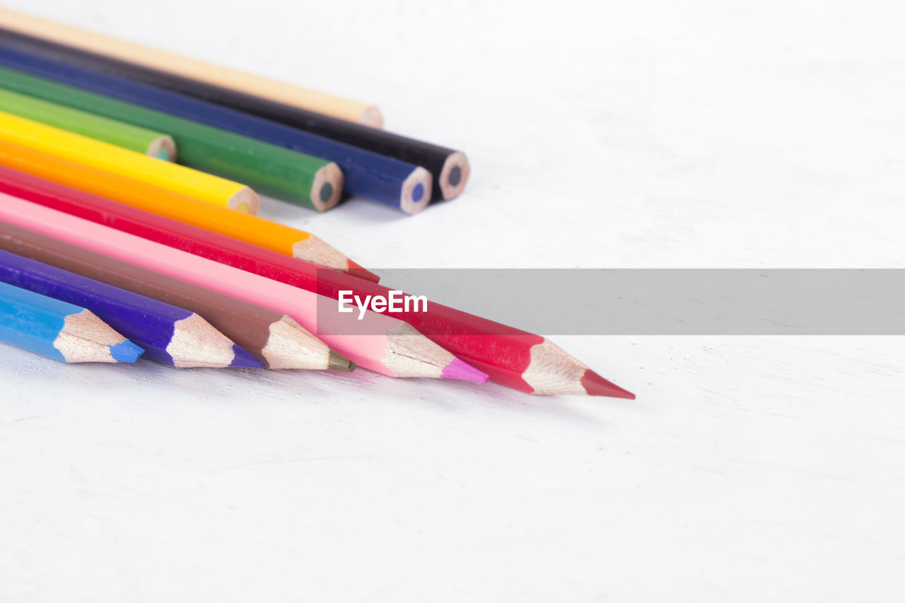 pencil, multi colored, writing instrument, colored pencil, white background, indoors, education, writing, variation, no people, craft, still life, eraser, office supplies, creativity, rubber, close-up, group of objects, studio shot, pen, copy space, paper, office supply, learning, office