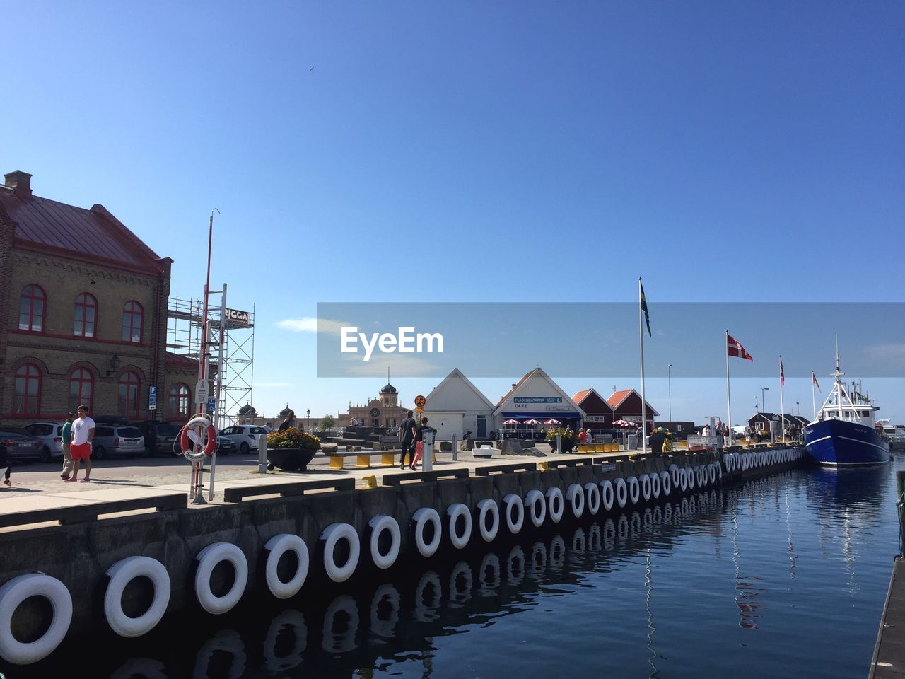 VIEW OF HOUSES AGAINST CLEAR BLUE SKY