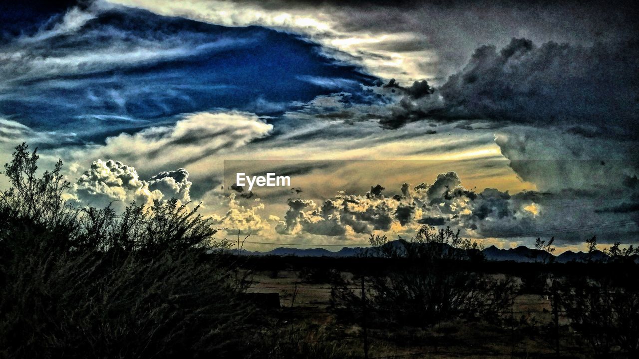 SCENIC VIEW OF LANDSCAPE AGAINST CLOUDY SKY