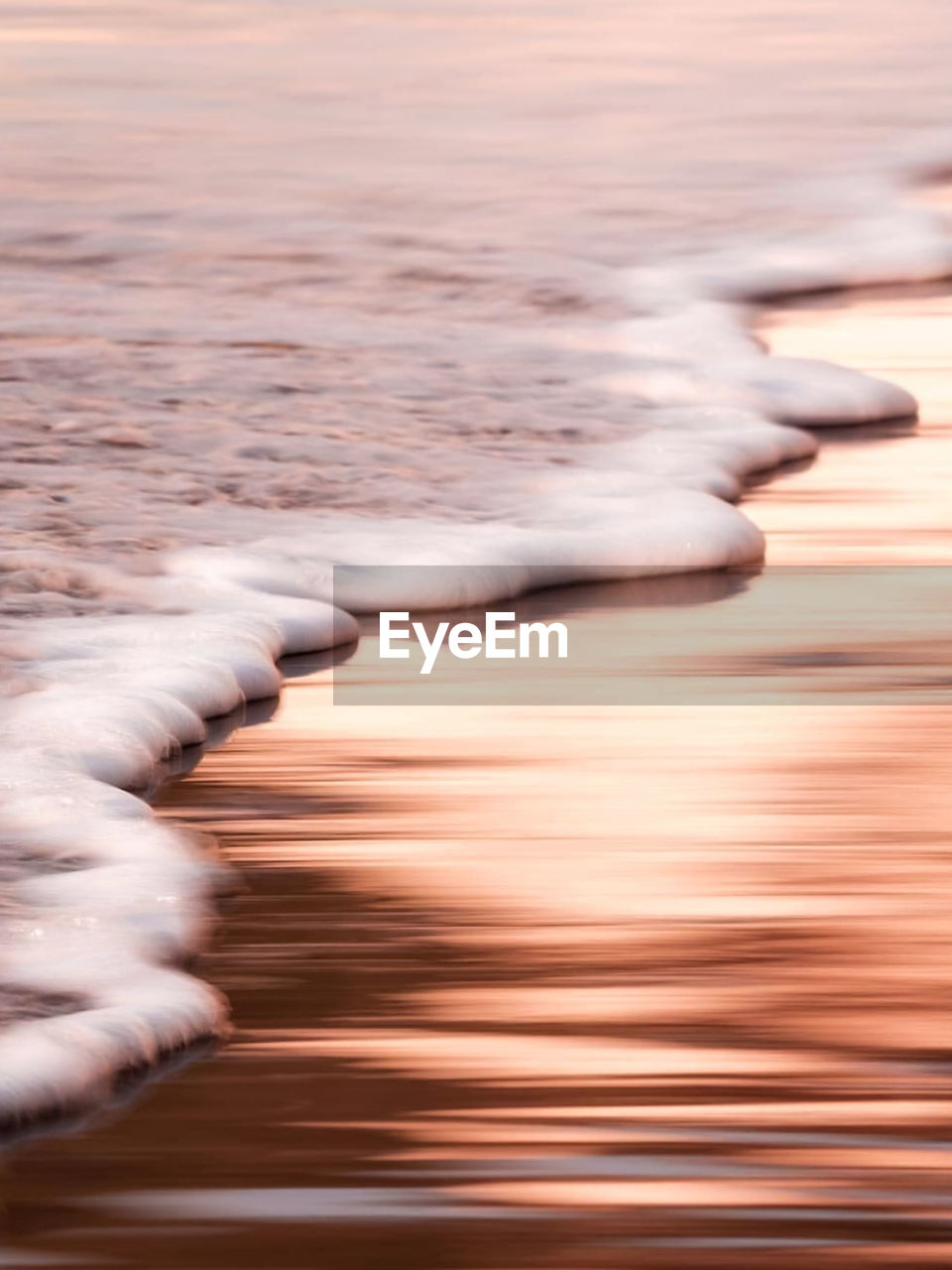 Blurred motion of sea at sunset