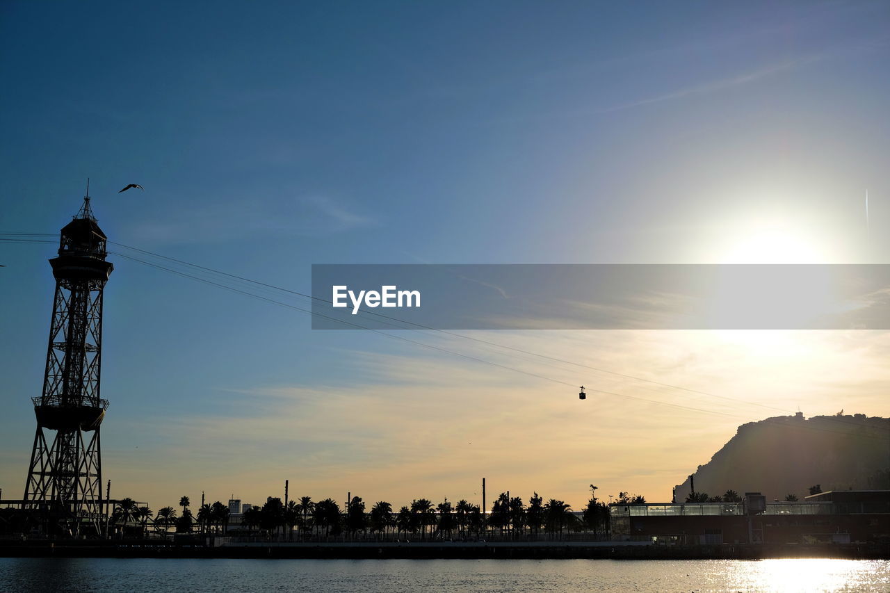 Silhouette of buildings at waterfront