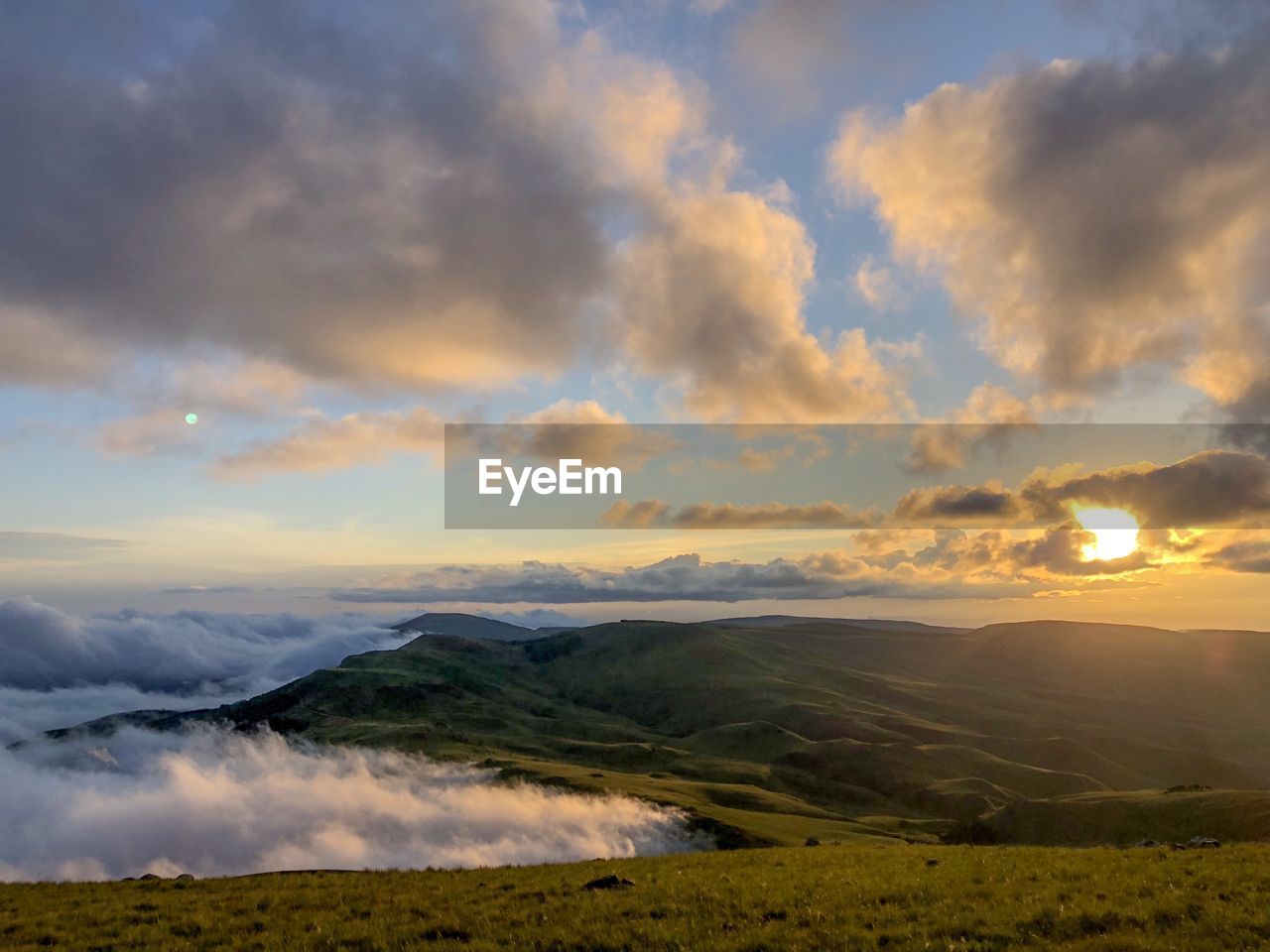 Scenic view of landscape against sky during sunset