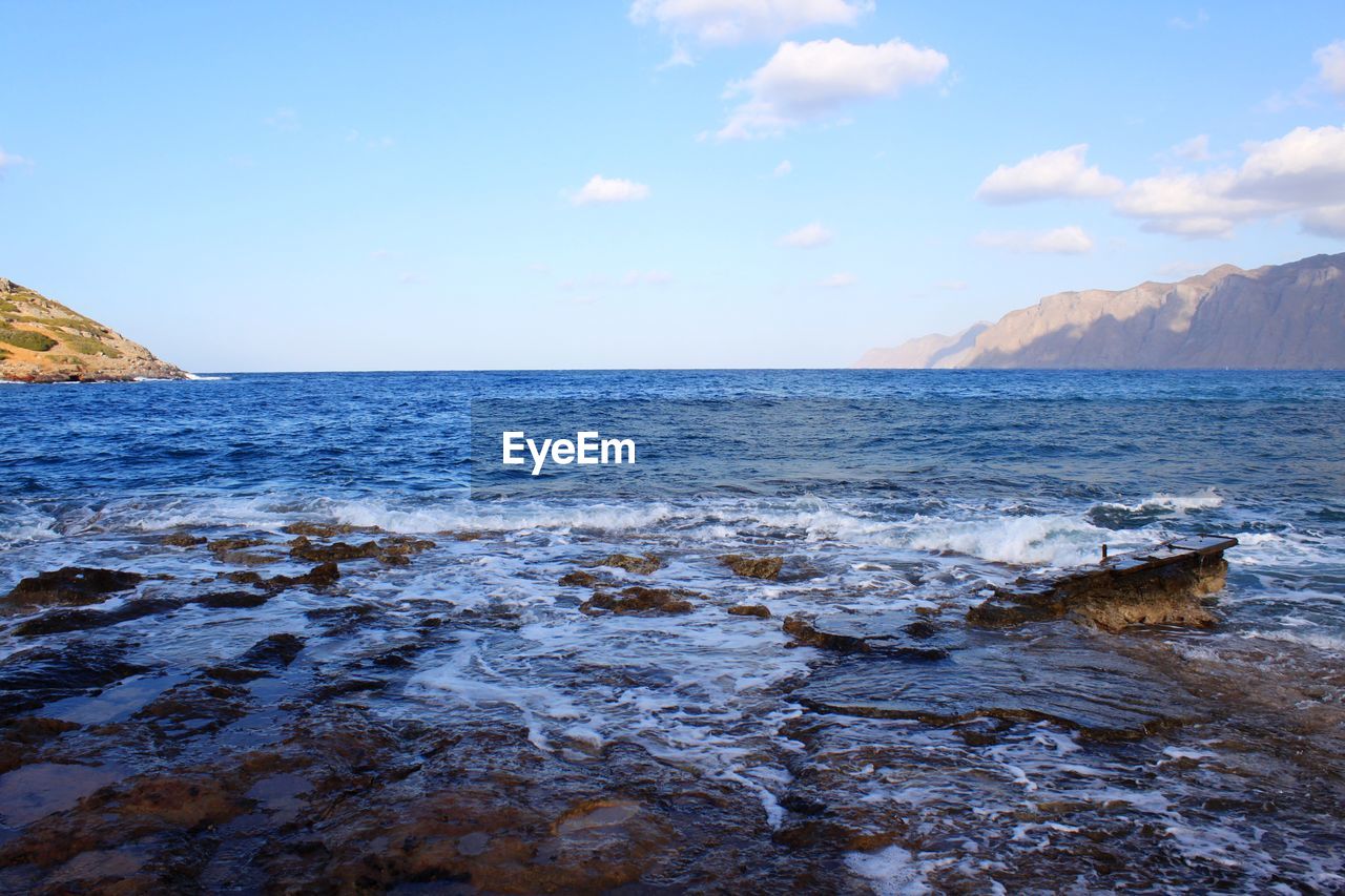 SCENIC VIEW OF SEA AND BEACH AGAINST SKY