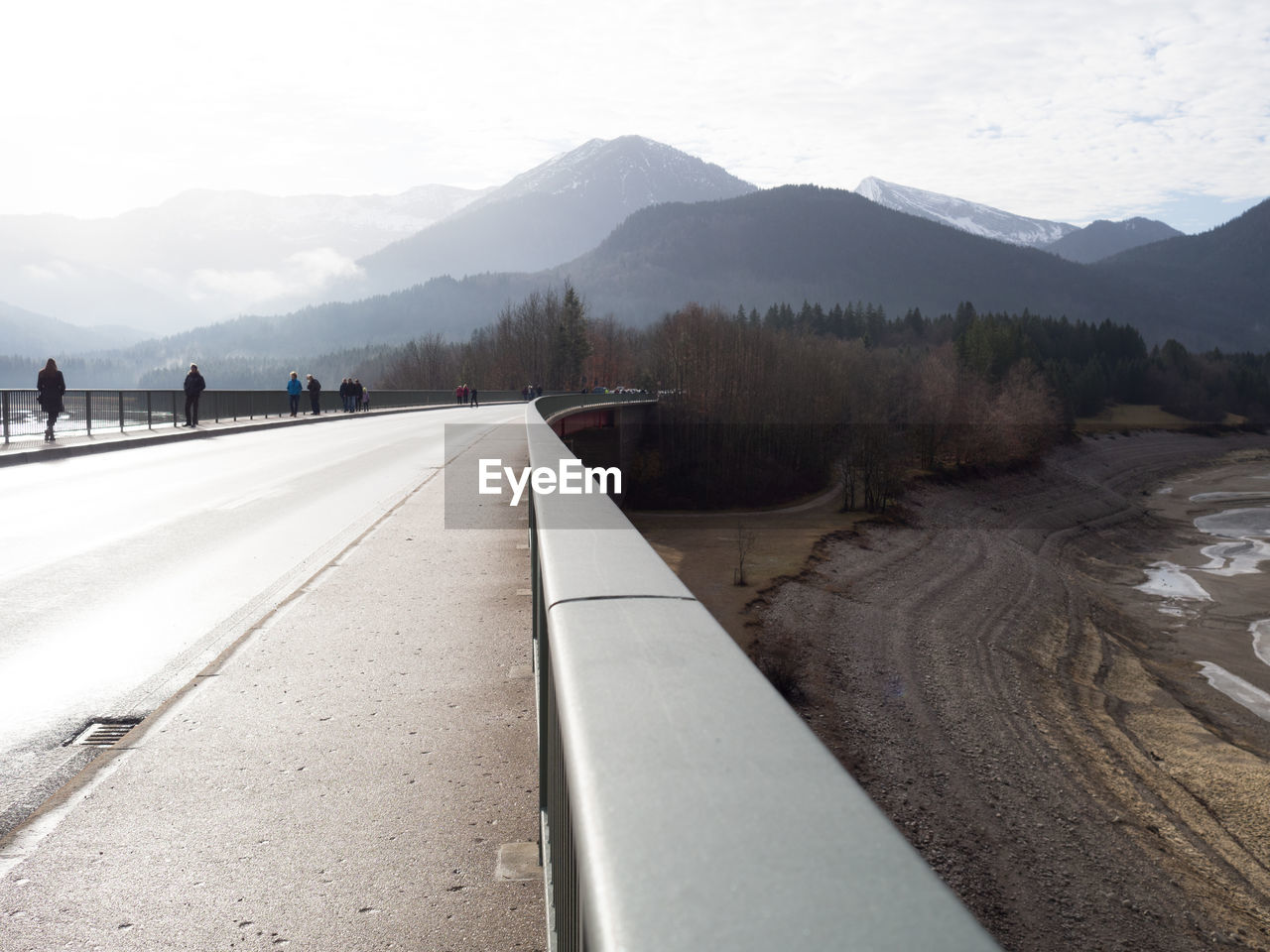 Empty road against mountain range