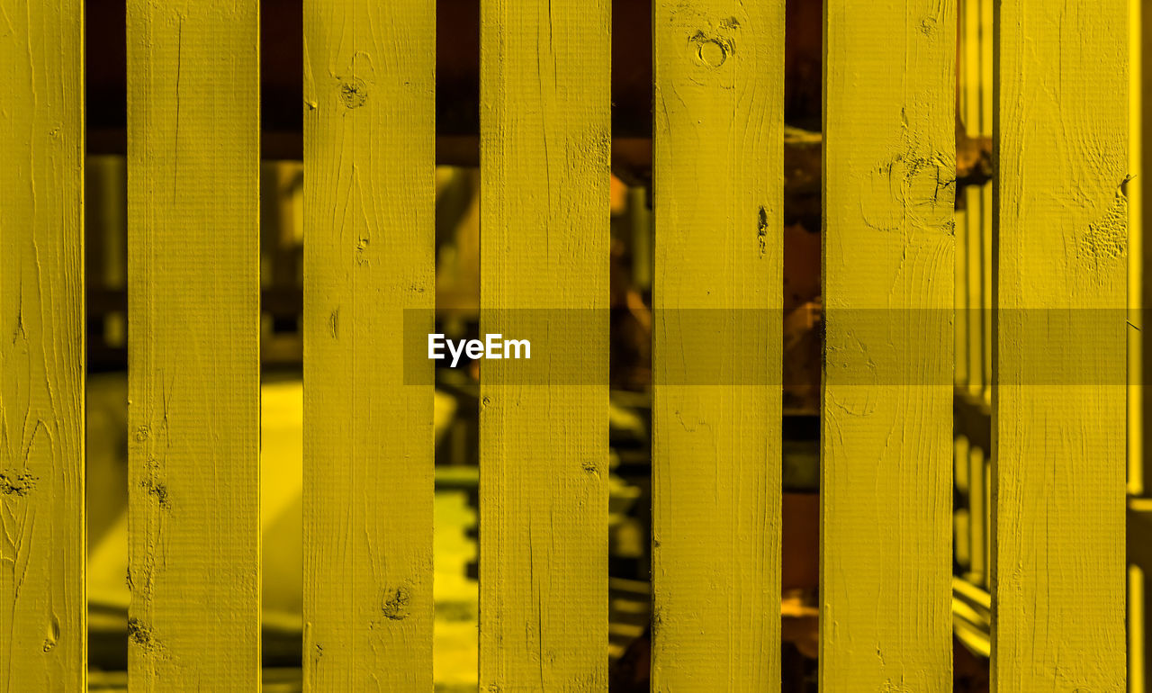 FULL FRAME SHOT OF YELLOW WOODEN WALL