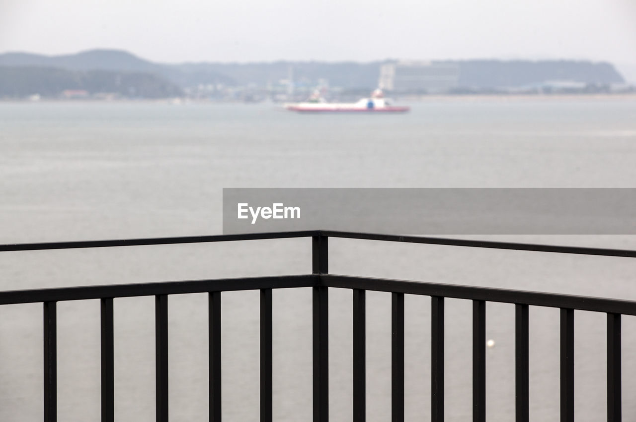 Distance shot of boat in calm sea