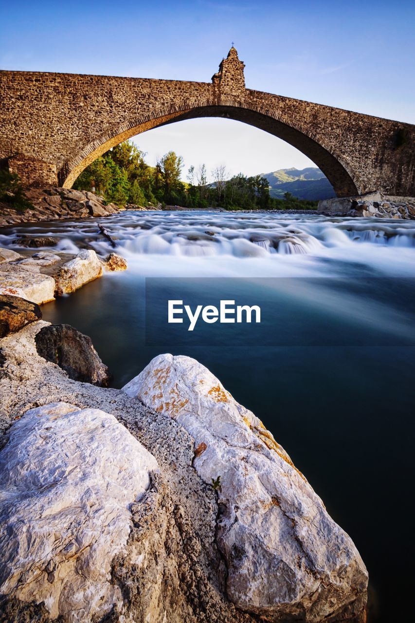 ARCH BRIDGE OVER RIVER