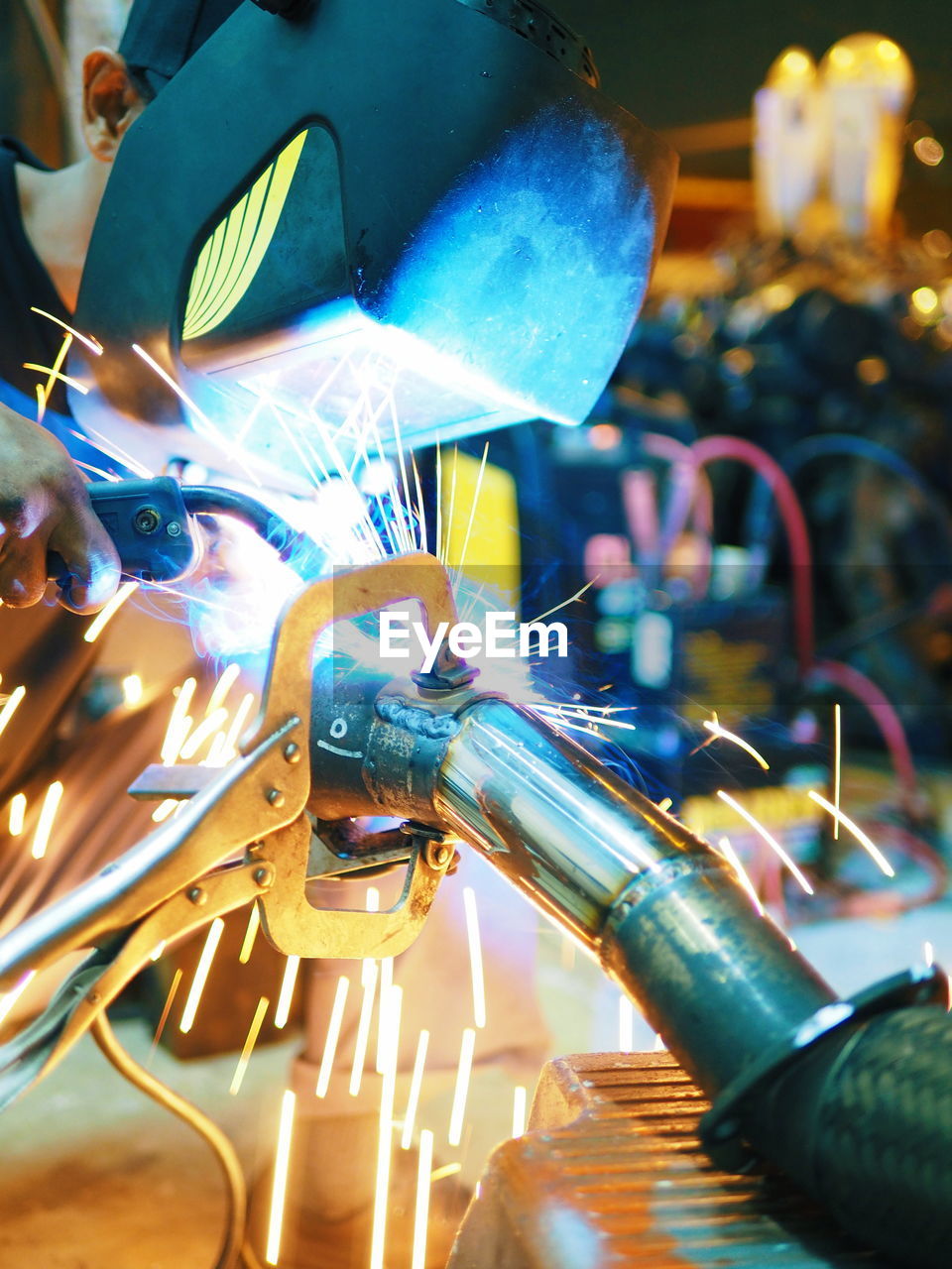 Close-up of worker welding equipment