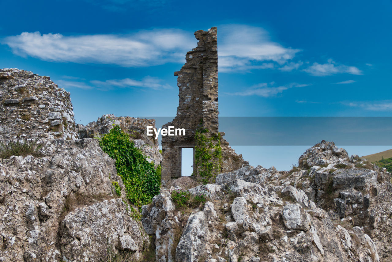 Low angle view of old ruin building against sky