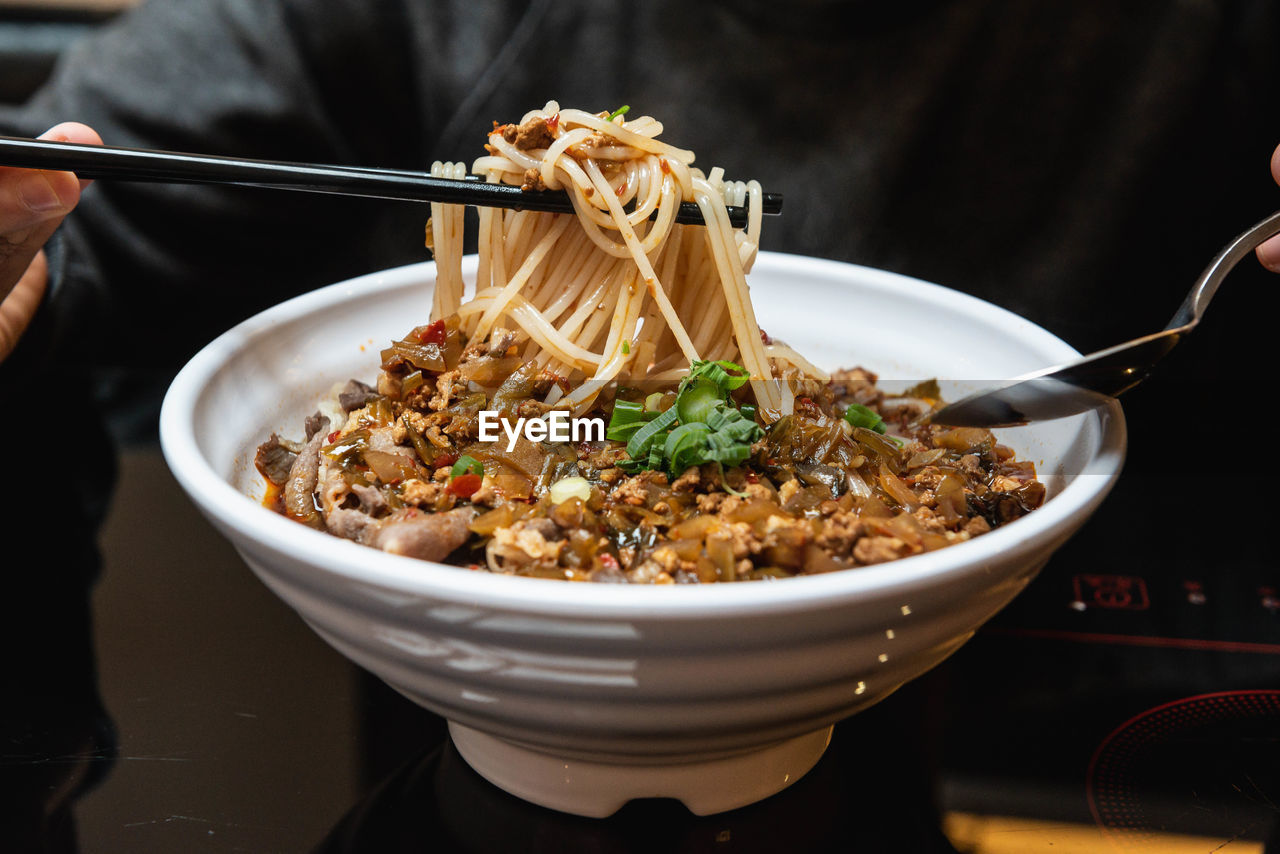 Close-up of noodle in bowl on table