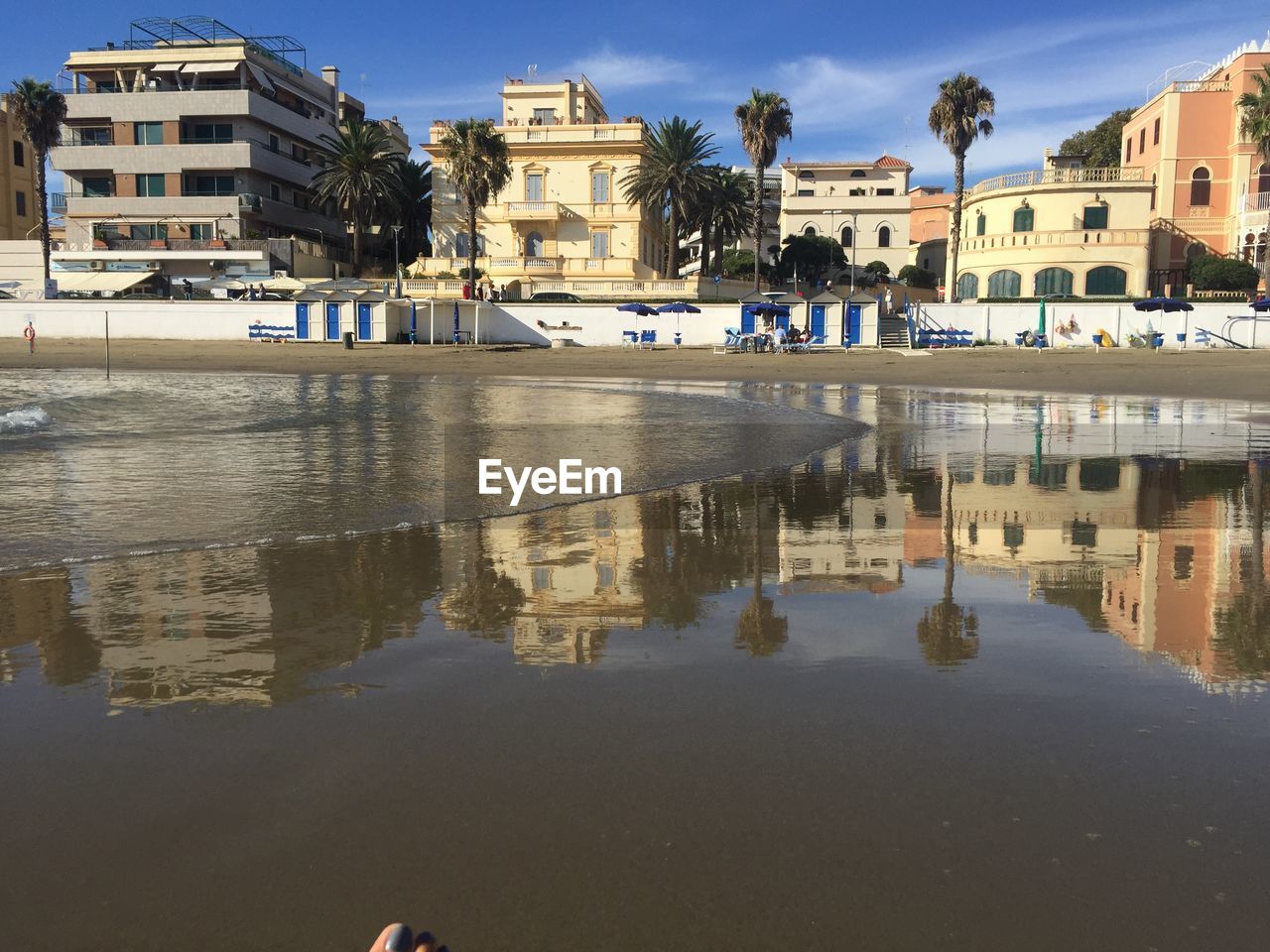 Reflection of buildings in puddle