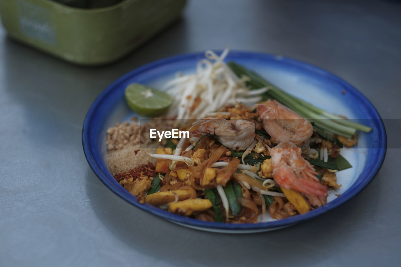 food and drink, food, healthy eating, wellbeing, thai food, dish, freshness, bowl, cuisine, indoors, vegetable, no people, meat, plate, meal, asian food, table, close-up, seafood, produce, high angle view, focus on foreground