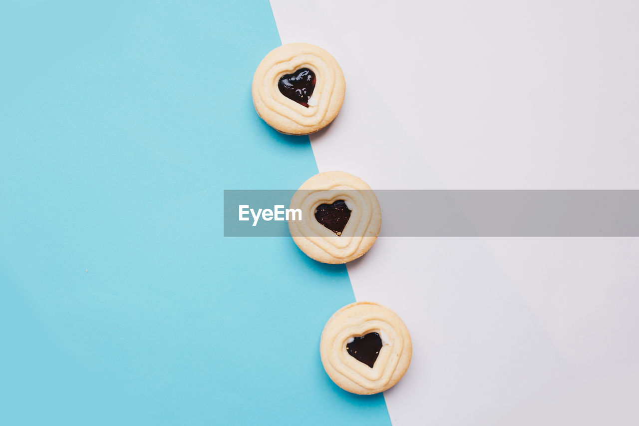 Heart shape cookies over colored background