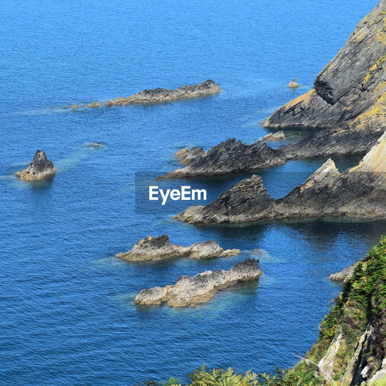 High angle view of rock formation in sea