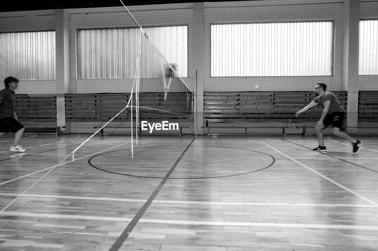 Men playing badminton