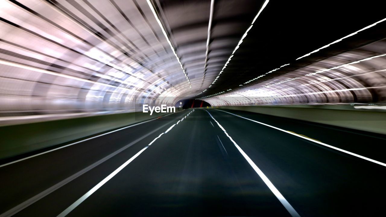 Blurred motion of illuminated subway station