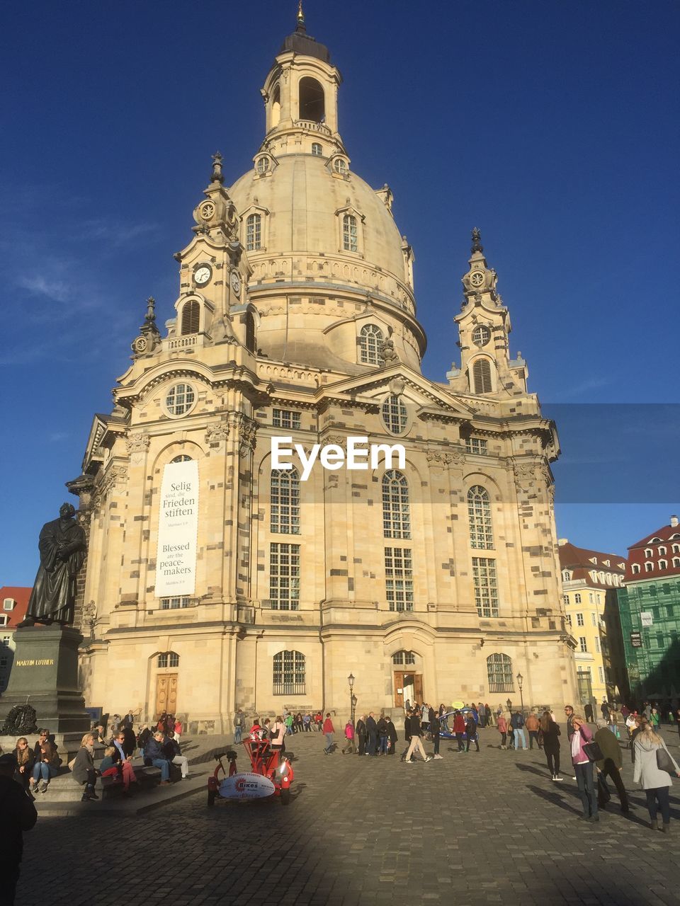 GROUP OF PEOPLE IN FRONT OF CHURCH