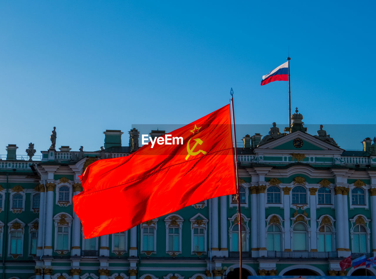 FLAG ON BUILDING AGAINST SKY