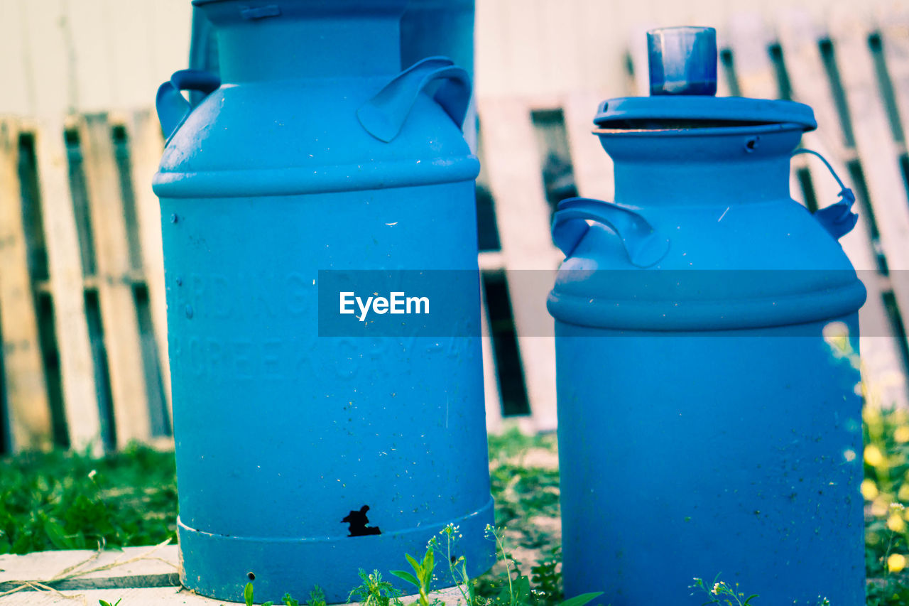 Close-up of blue canisters