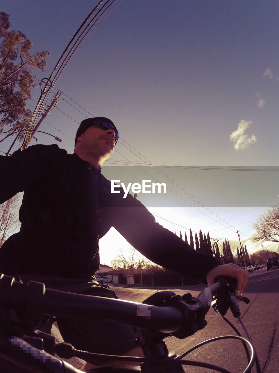 PERSON RIDING BICYCLE ON ROAD