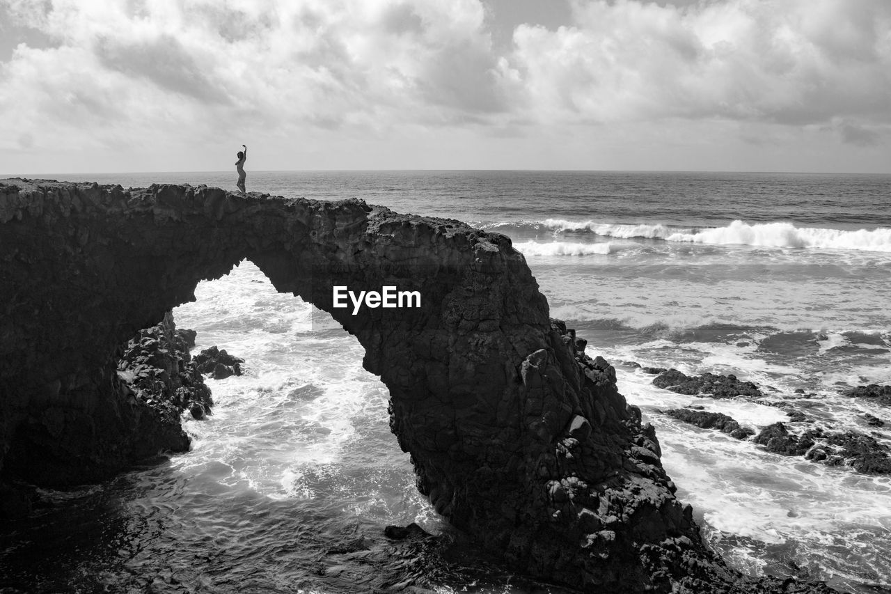 Scenic view of sea against cloudy sky