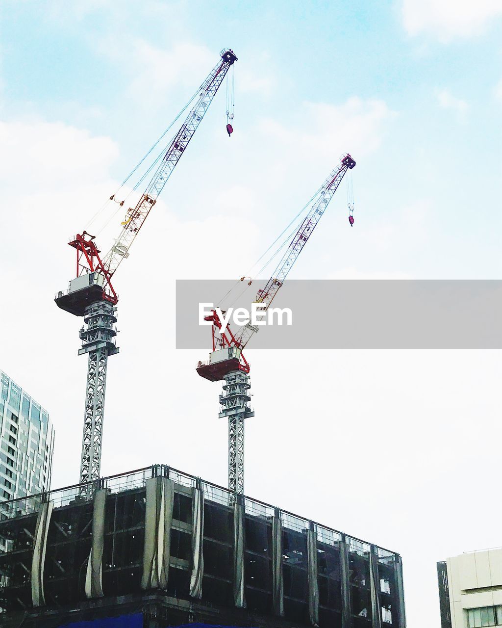 LOW ANGLE VIEW OF CRANE AT CONSTRUCTION SITE