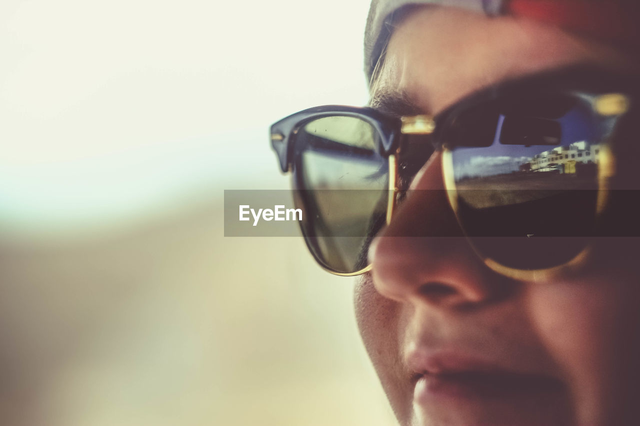 Close-up of young woman wearing sunglasses