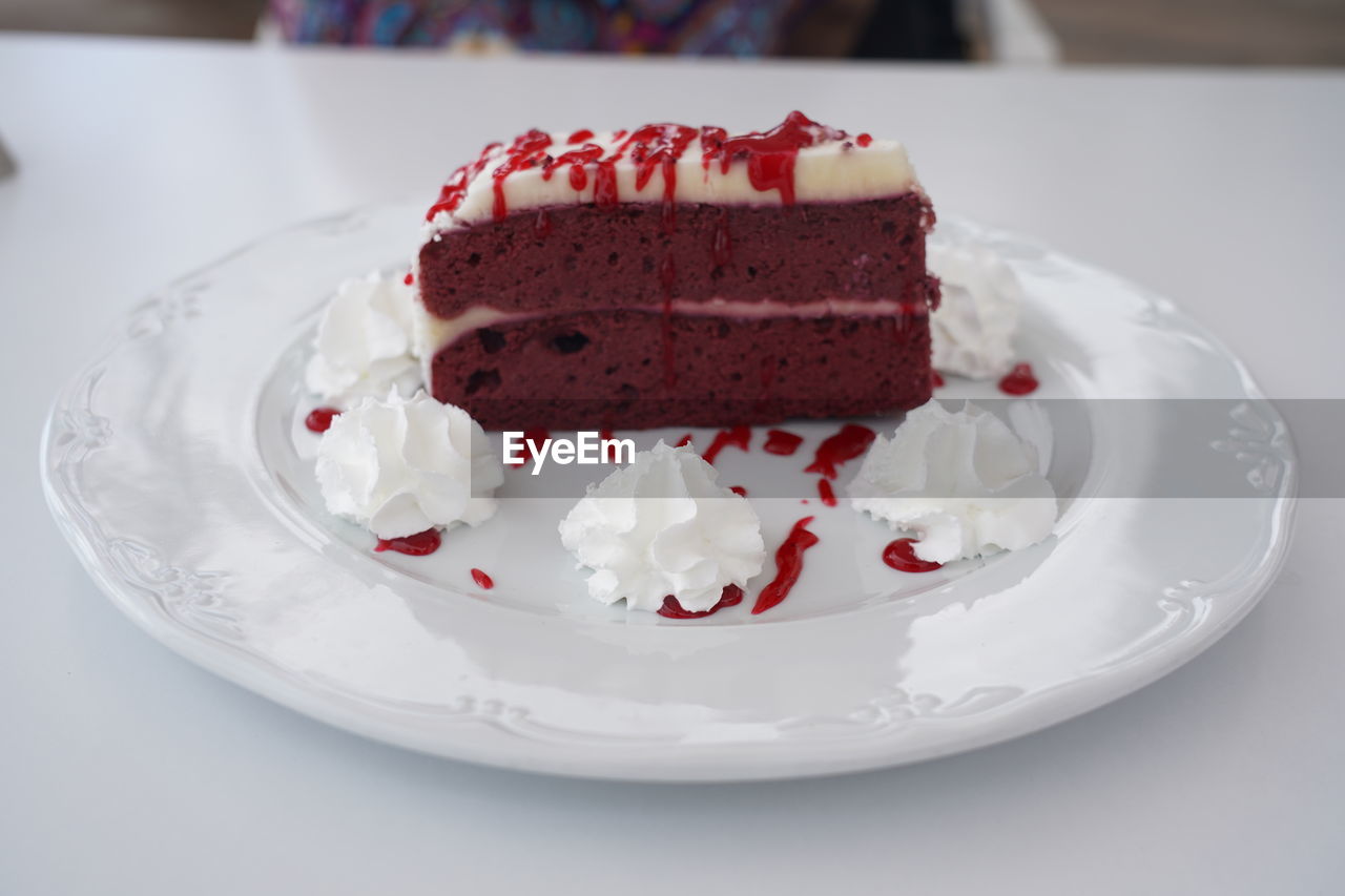 Delicious red velvet cake served on plate in restaurant