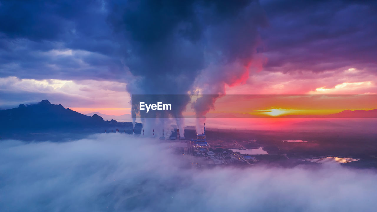 Aerial view coal power plant station in the morning mist, the morning sun rises. mae moh, lampang, 