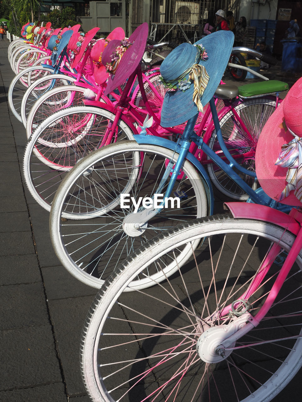 HIGH ANGLE VIEW OF BICYCLE PARKED ON FOOTPATH