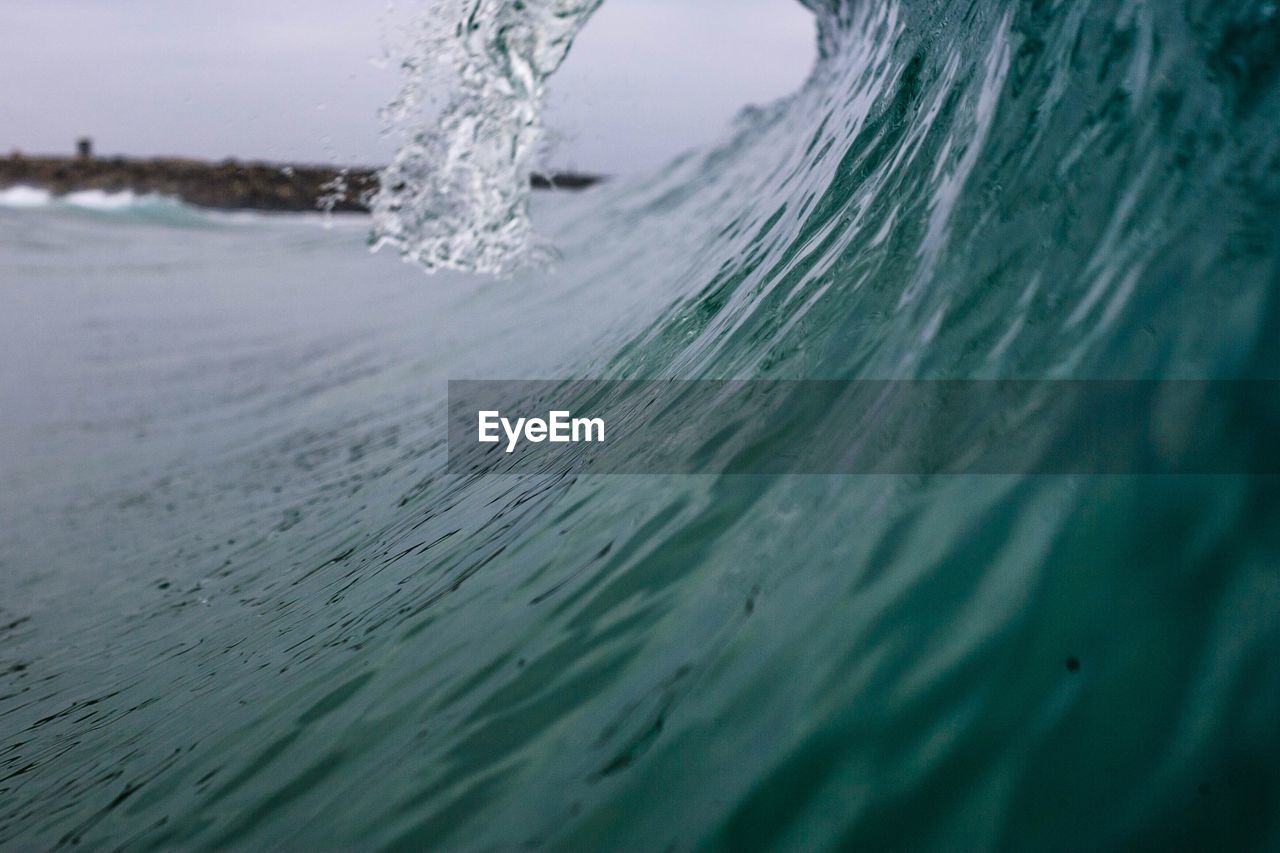 Close-up of wave splashing on beach
