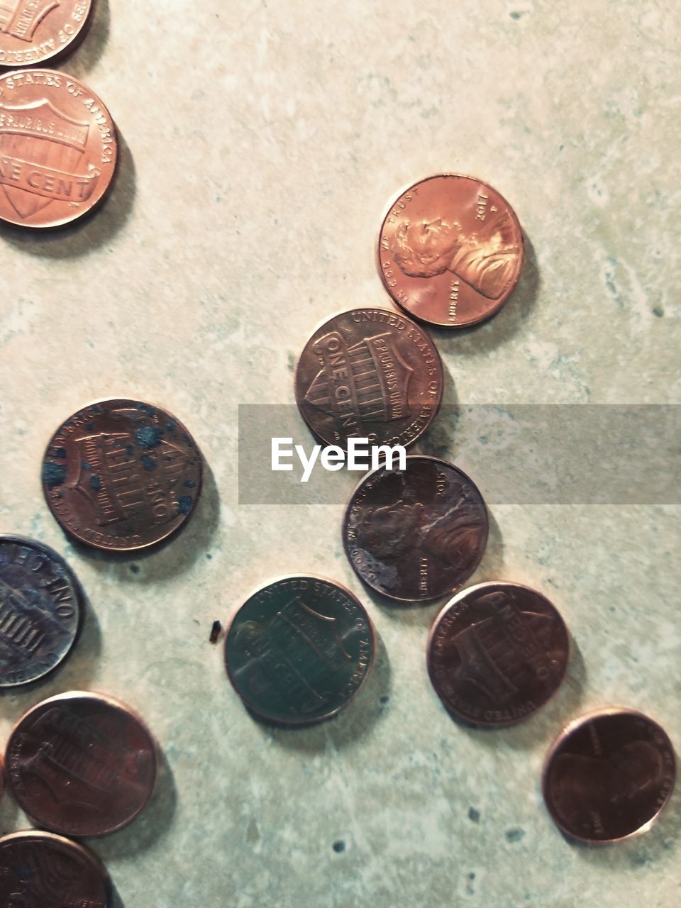 CLOSE-UP OF COINS IN TABLE