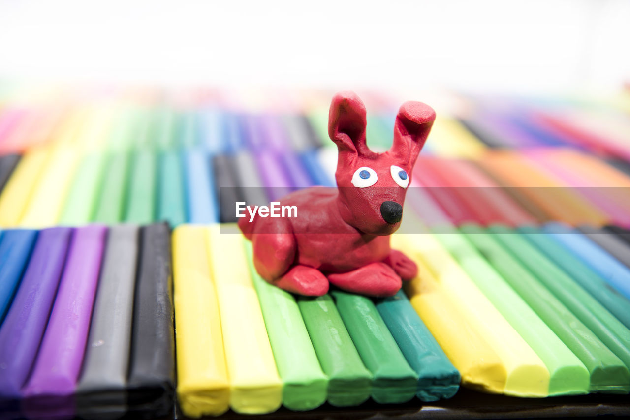 Close-up of toy on crayons