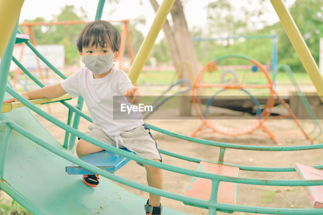 Boy playing in playground