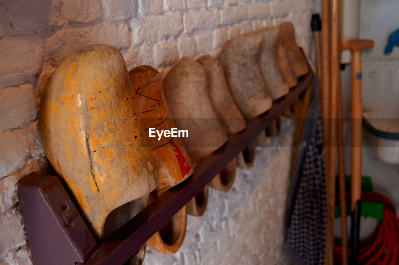 CLOSE-UP OF MEAT HANGING ON WOOD