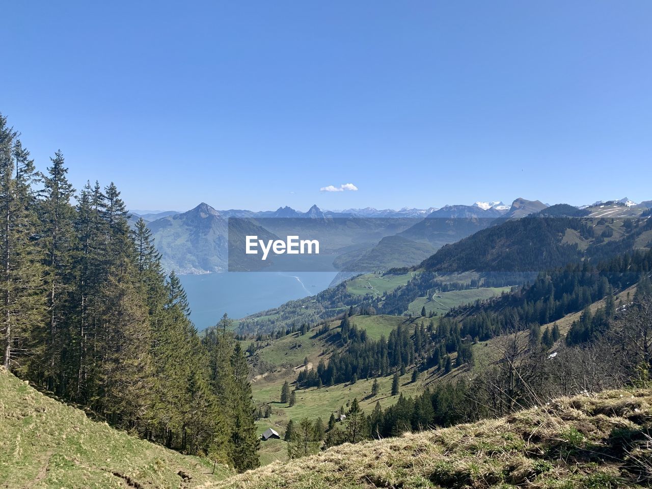 Scenic view of mountains against clear blue sky