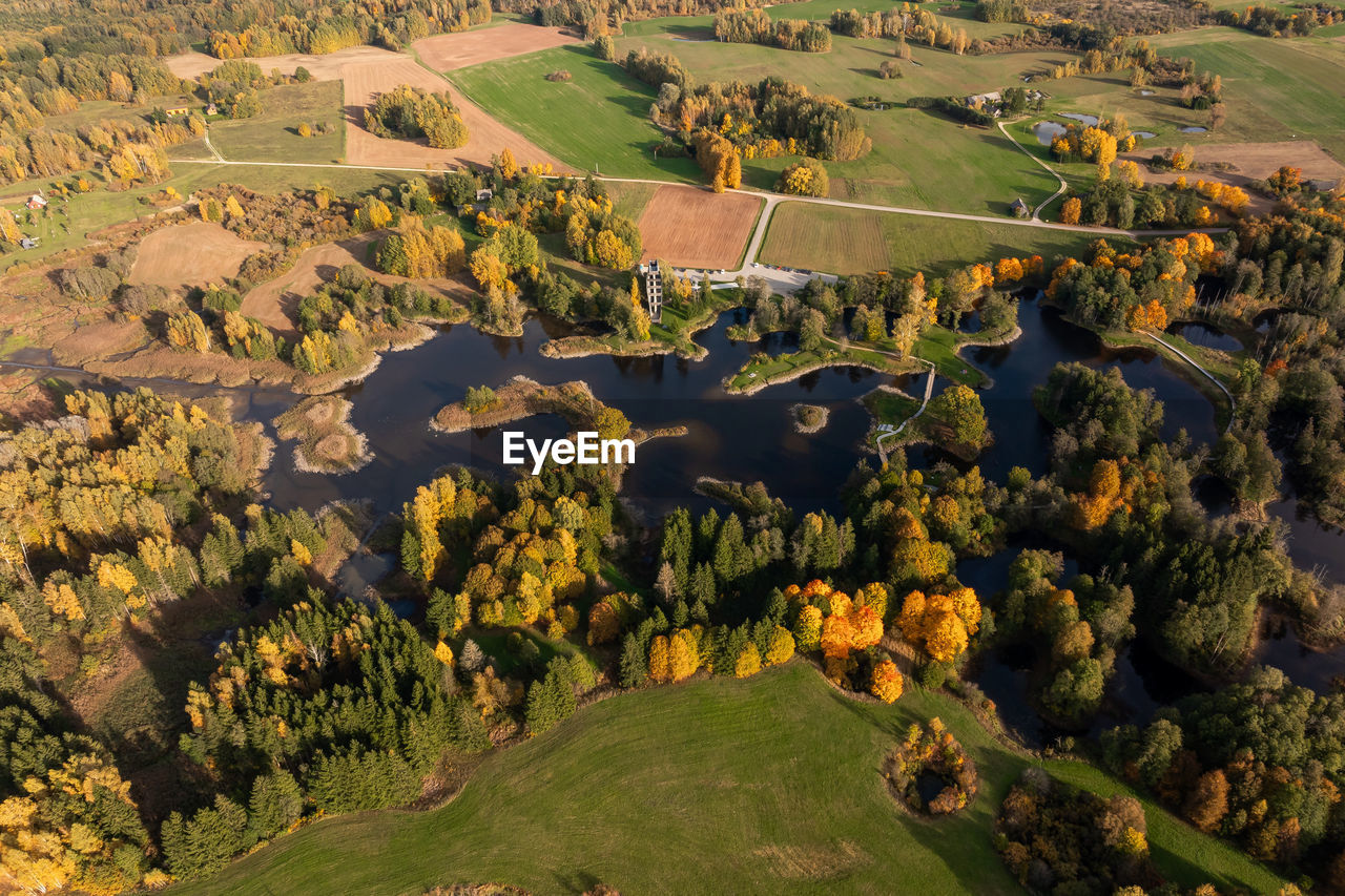 landscape, environment, aerial photography, scenics - nature, land, nature, plant, aerial view, field, beauty in nature, agriculture, rural scene, high angle view, bird's-eye view, no people, non-urban scene, tranquility, tree, tranquil scene, outdoors, green, day, farm, water, travel destinations, growth, travel, grass, architecture, idyllic, hill, sunlight, rural area, valley, autumn, plain, tourism