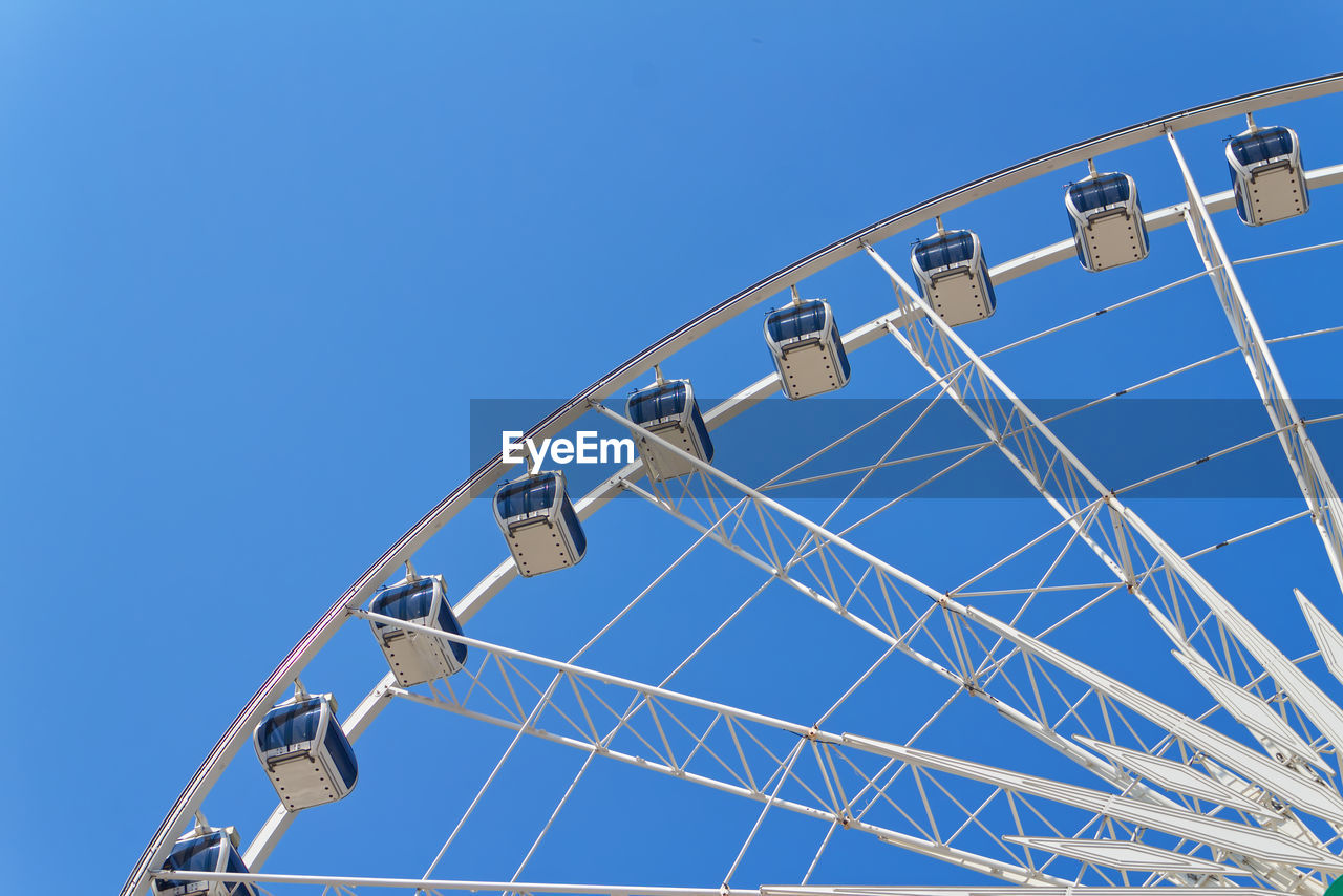 LOW ANGLE VIEW OF FERRIS WHEEL AGAINST SKY