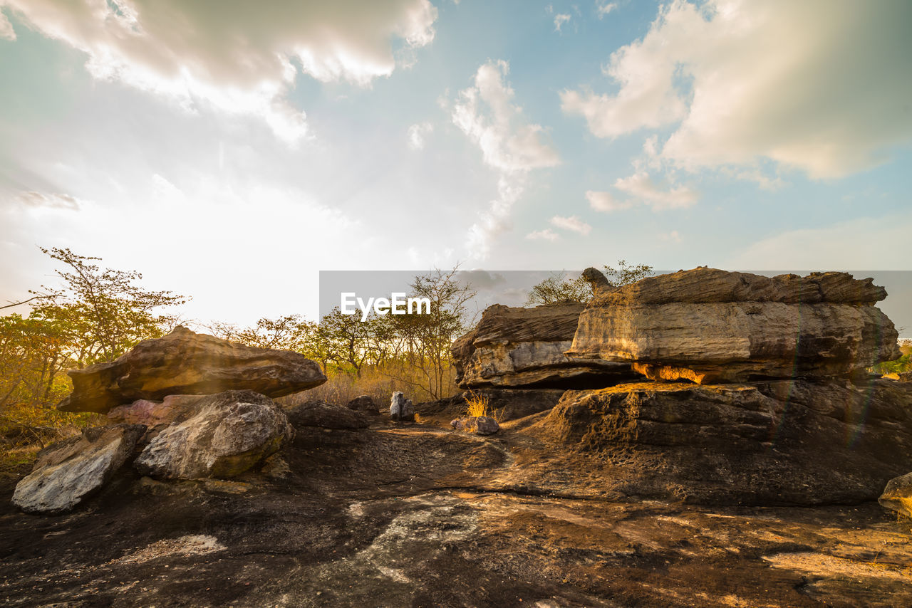 ROCK FORMATION ON LAND AGAINST SKY