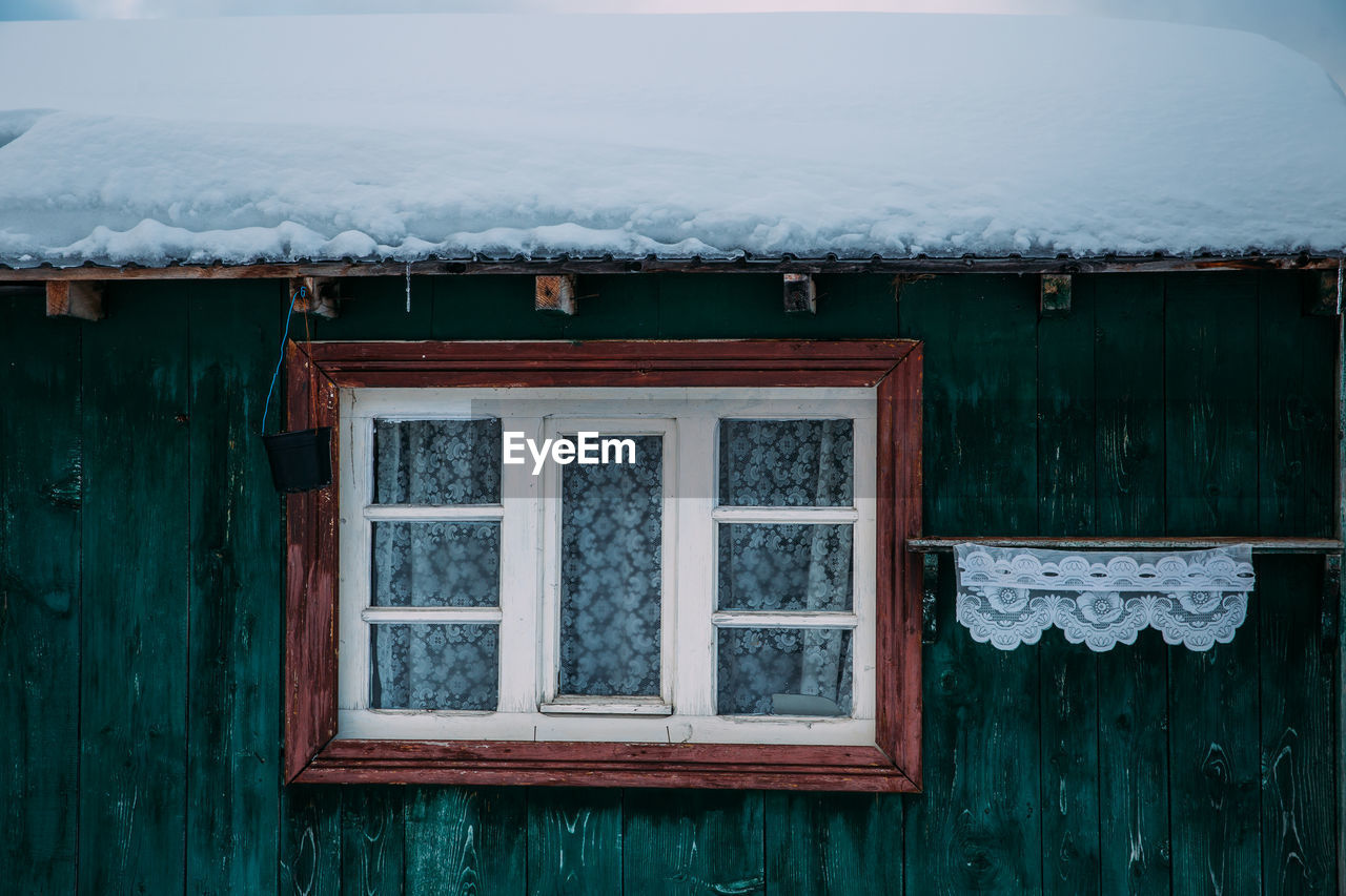 Snow on roof of building