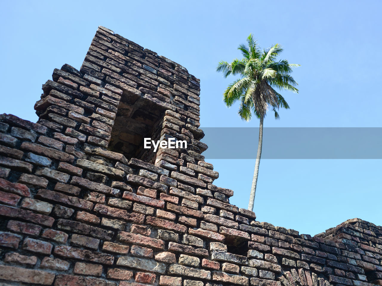 low angle view of old ruins against clear sky