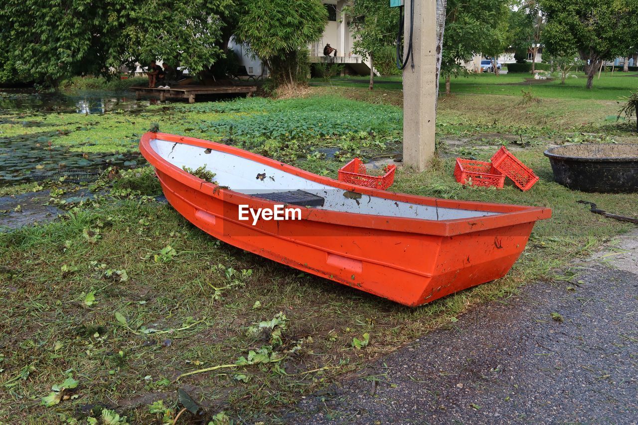 BOAT MOORED ON LAND