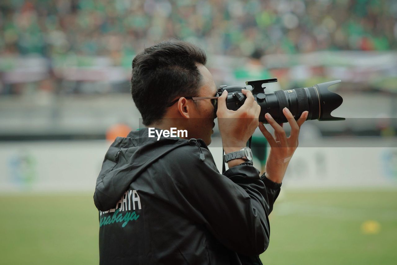 Man photographing with camera