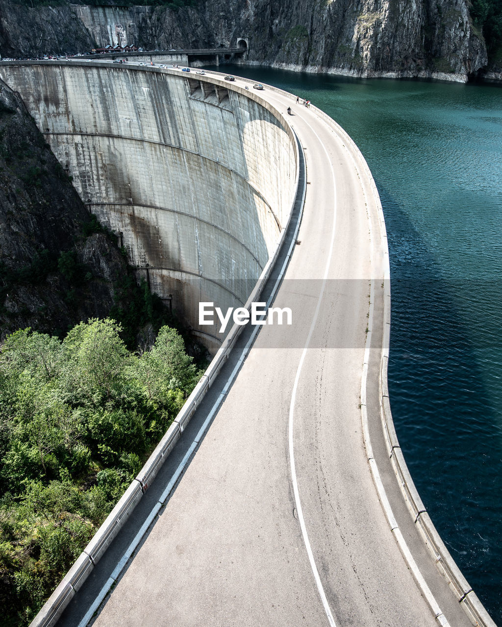 High angle view of dam with lake and ridge